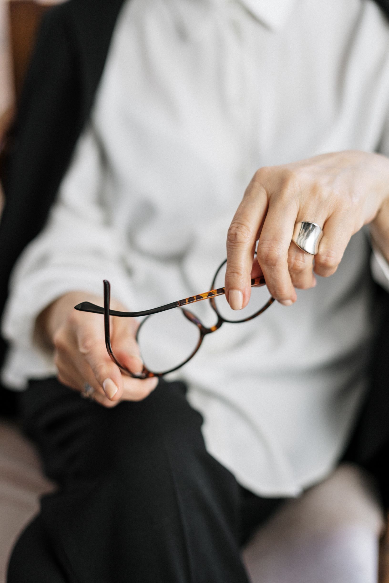 Woman Holding Glasses